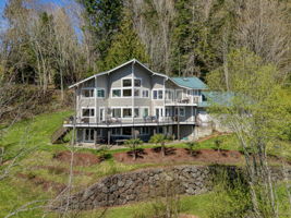 Water side of the home...the architecture gives views from nearly every room!