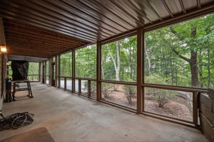 Lower level enclosed patio that leads to terrace level living space