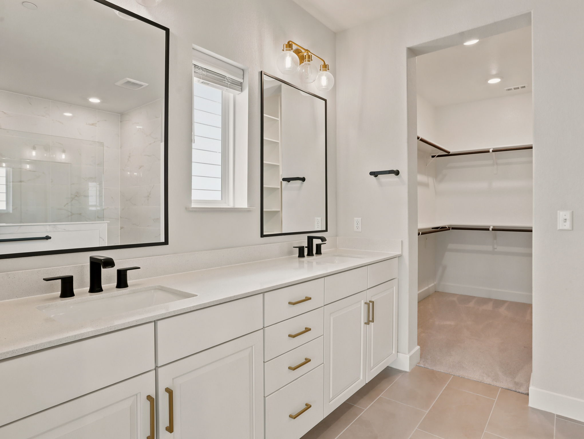 Primary Bathroom with Double Vanity and Walk-in Closet