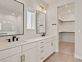 Primary Bathroom with Double Vanity and Walk-in Closet
