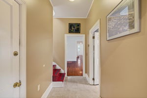 back stairs, half bath and hall way from living space to kitchen