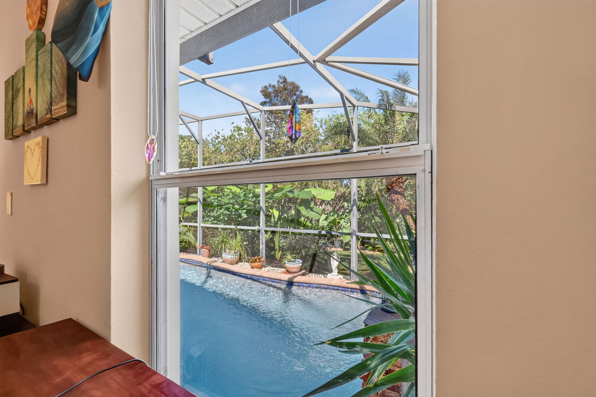 View of Swimming Pool and Tropical Landscaping from Third Bedroom!