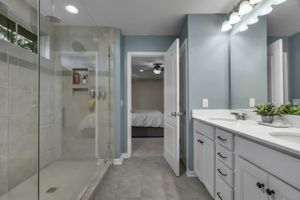 Upgraded walk in shower with full tile surround