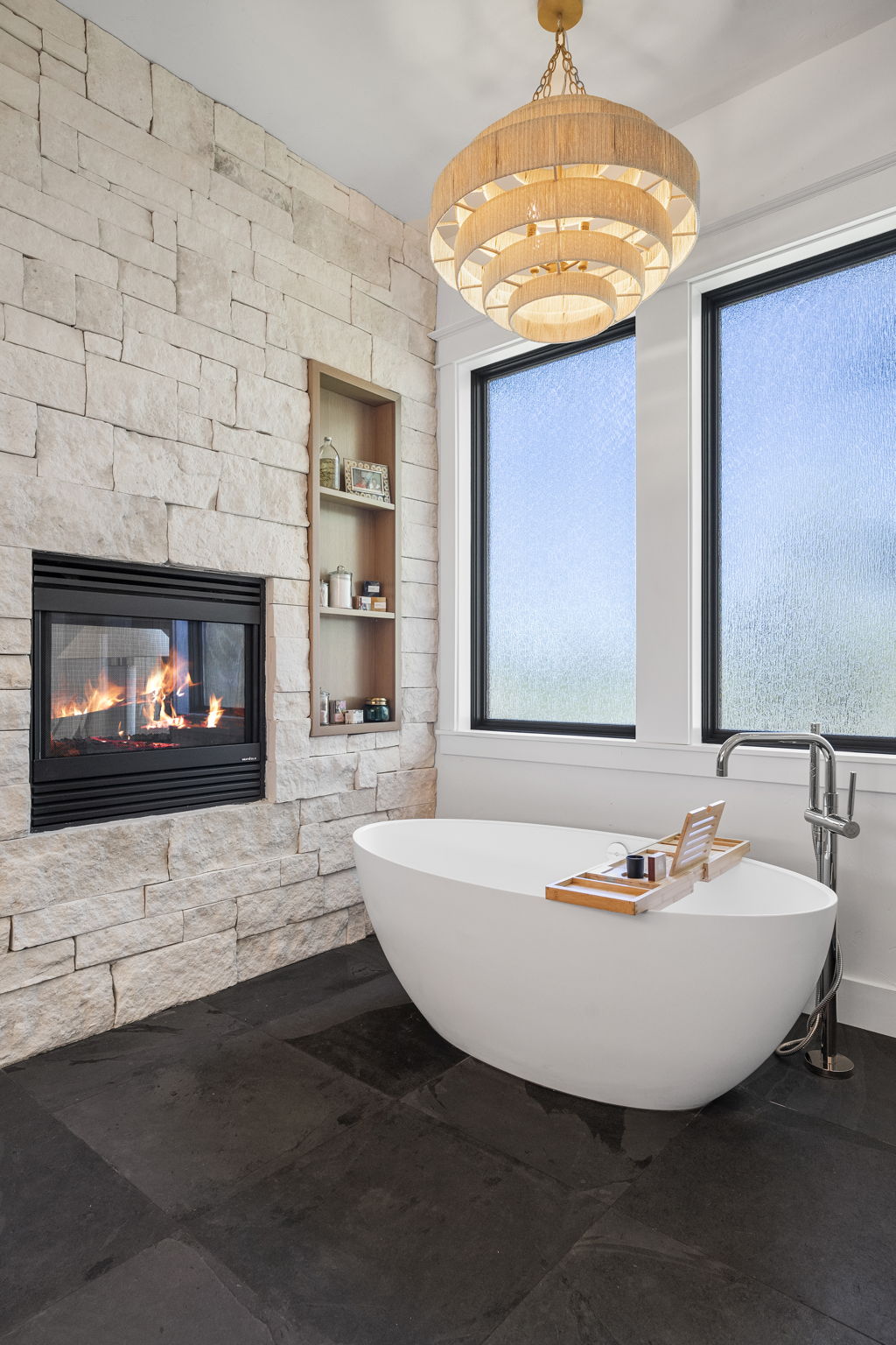 Limestone flanked dual sided gas fireplace