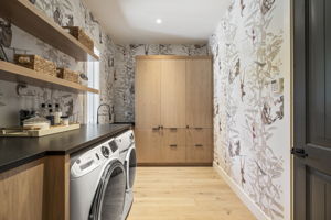 Huge laundry/mudroom with custom oak cabinetry