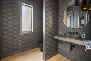 Lower level powder room with custom made Cement Elegance floating sink