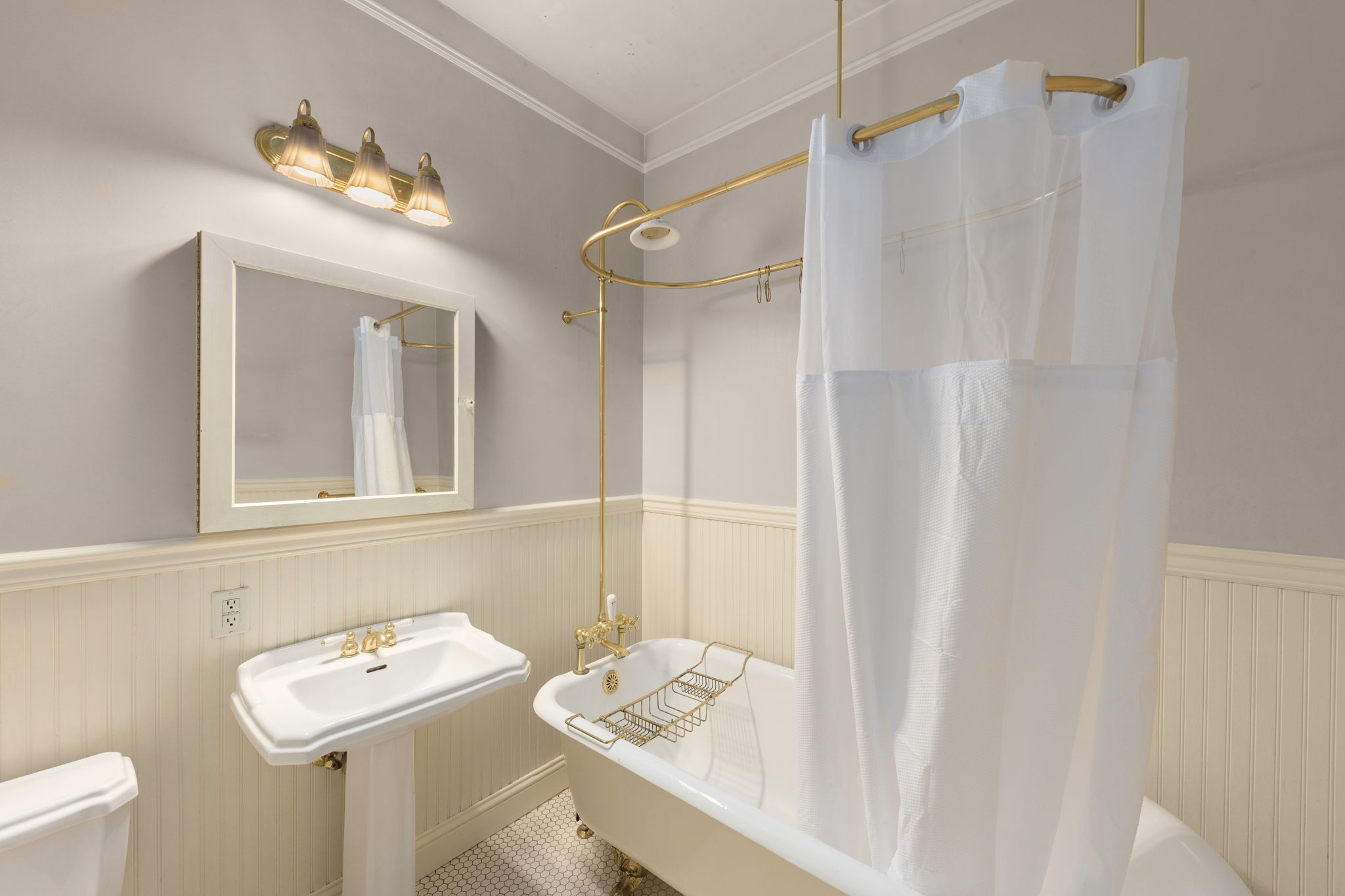 spacious bathroom with clawfoot tub