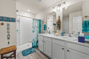 Primary Bathroom with Dual Sinks and Large Shower