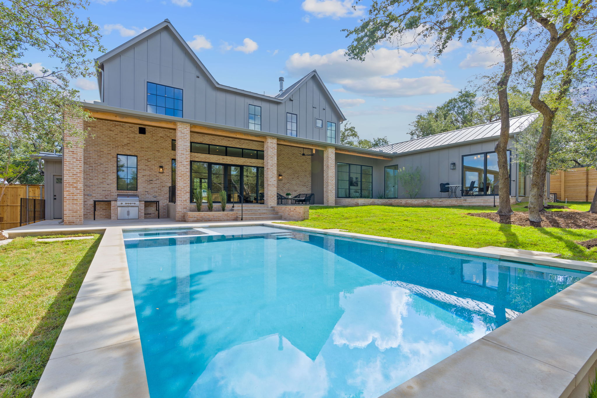 Sparkling pool that can be seen by the kitchen, living, sunroom vestibule, and primary bedroom