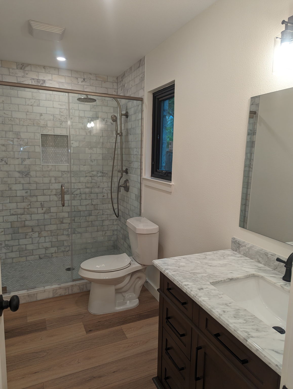 Marble master bath shower surround, new vanities and new toilet