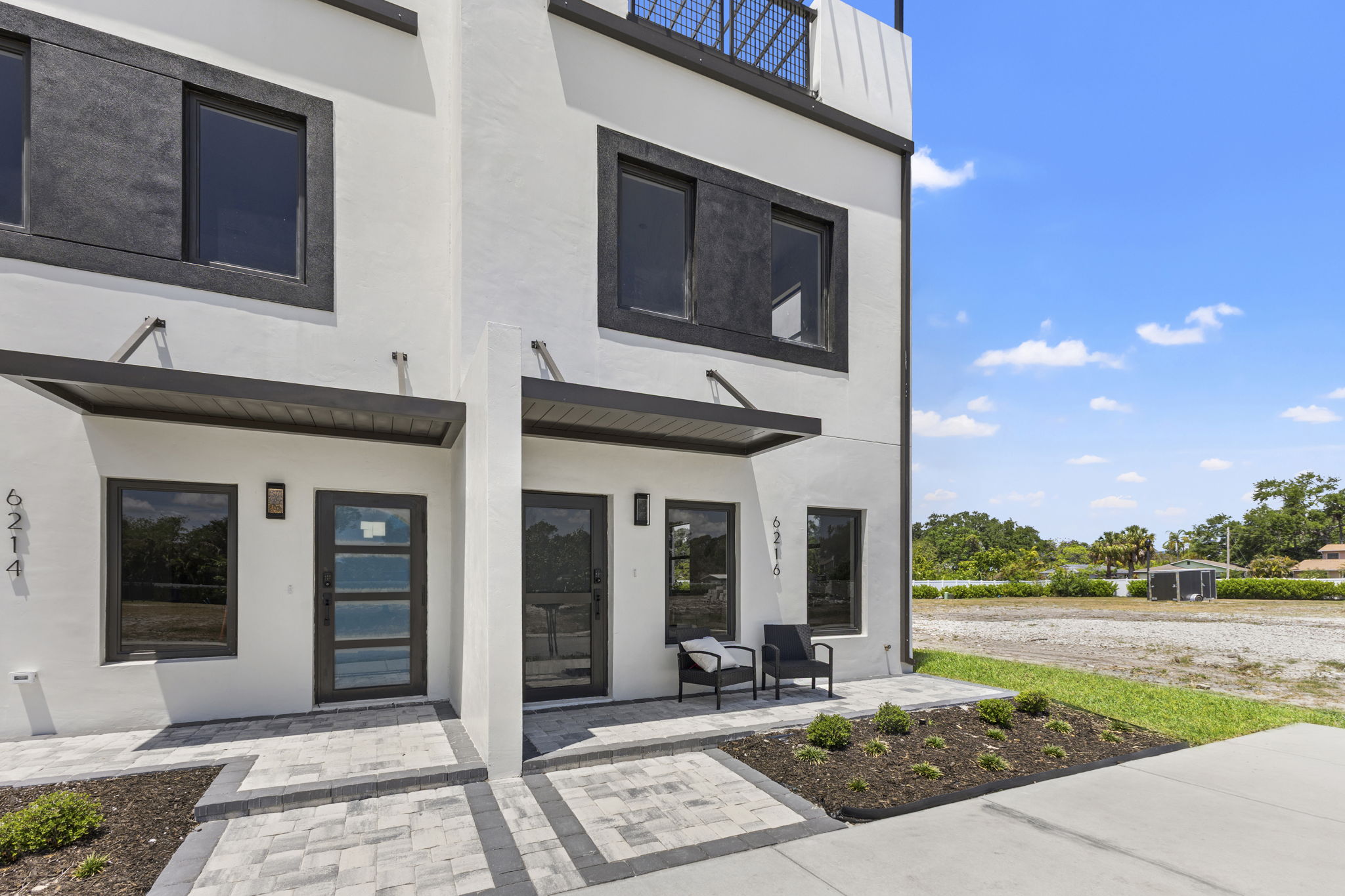 Private front entry and paver patio kept by the association at Latitudes in the Park, Pinellas Park FL