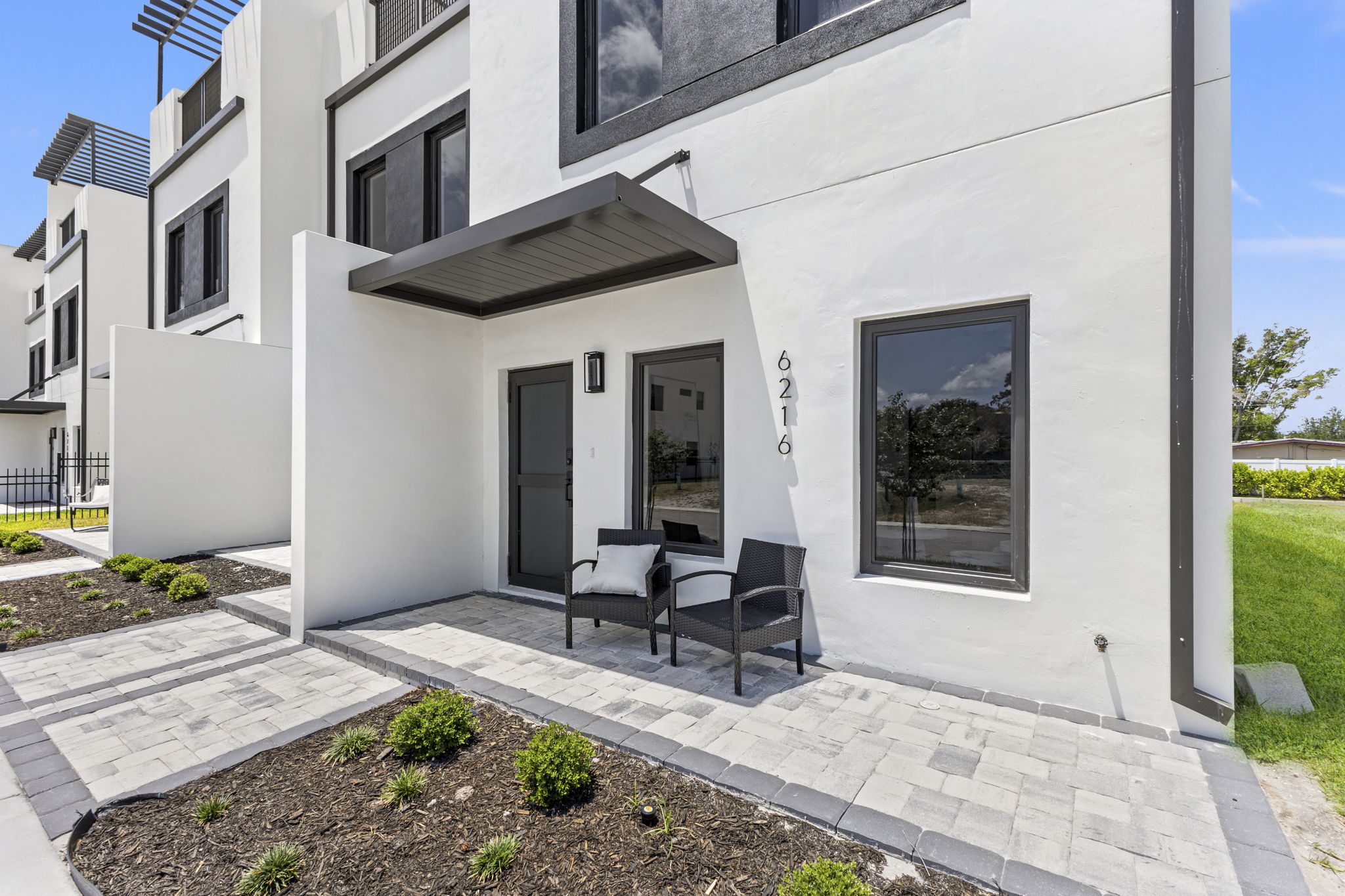 Covered entry raised above the driveway at a Latitudes residence
