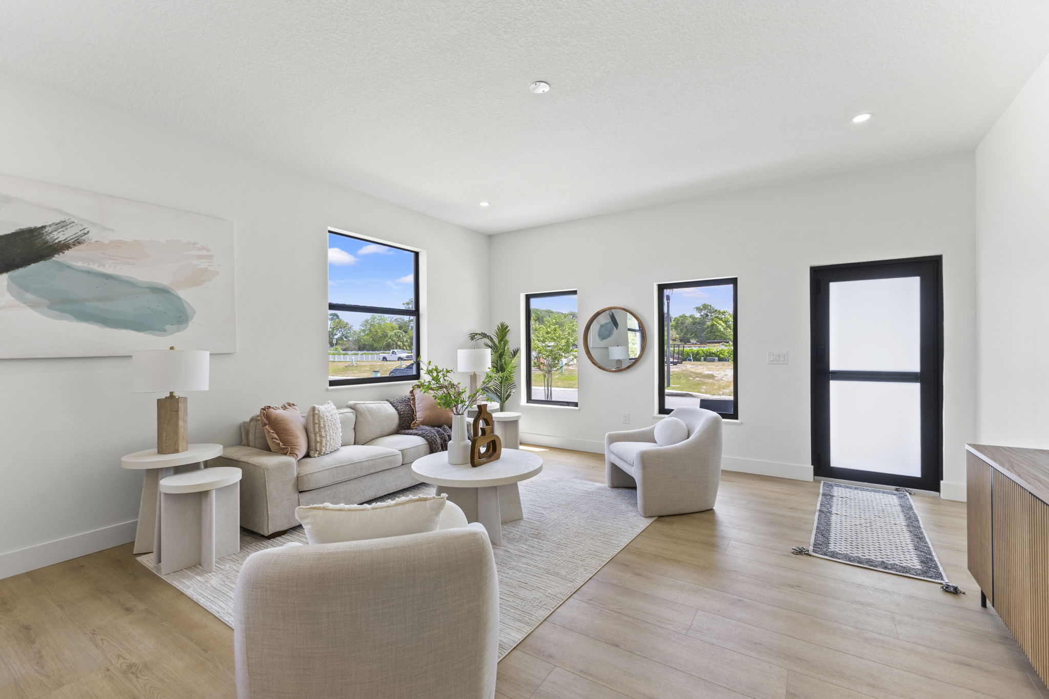 Living room and the front door at Latitudes in the Park, Pinellas Park FL