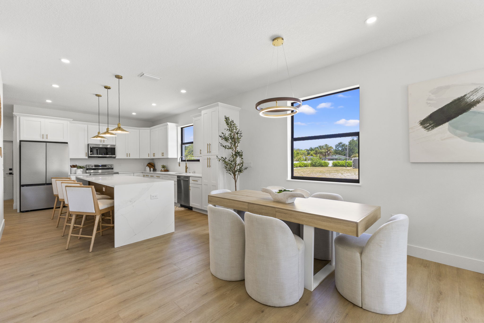 Kitchen open to the dining area at Latitudes in the Park, Pinellas Park FL