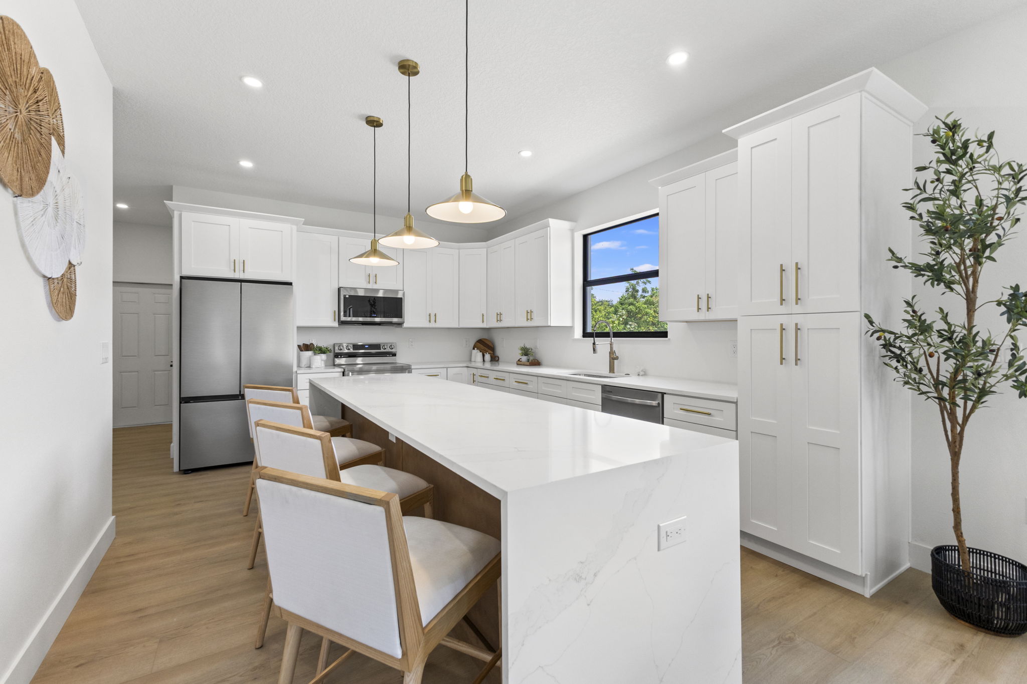 Kitchen, pantry and stainless appliances at Latitudes in the Park, Pinellas Park FL