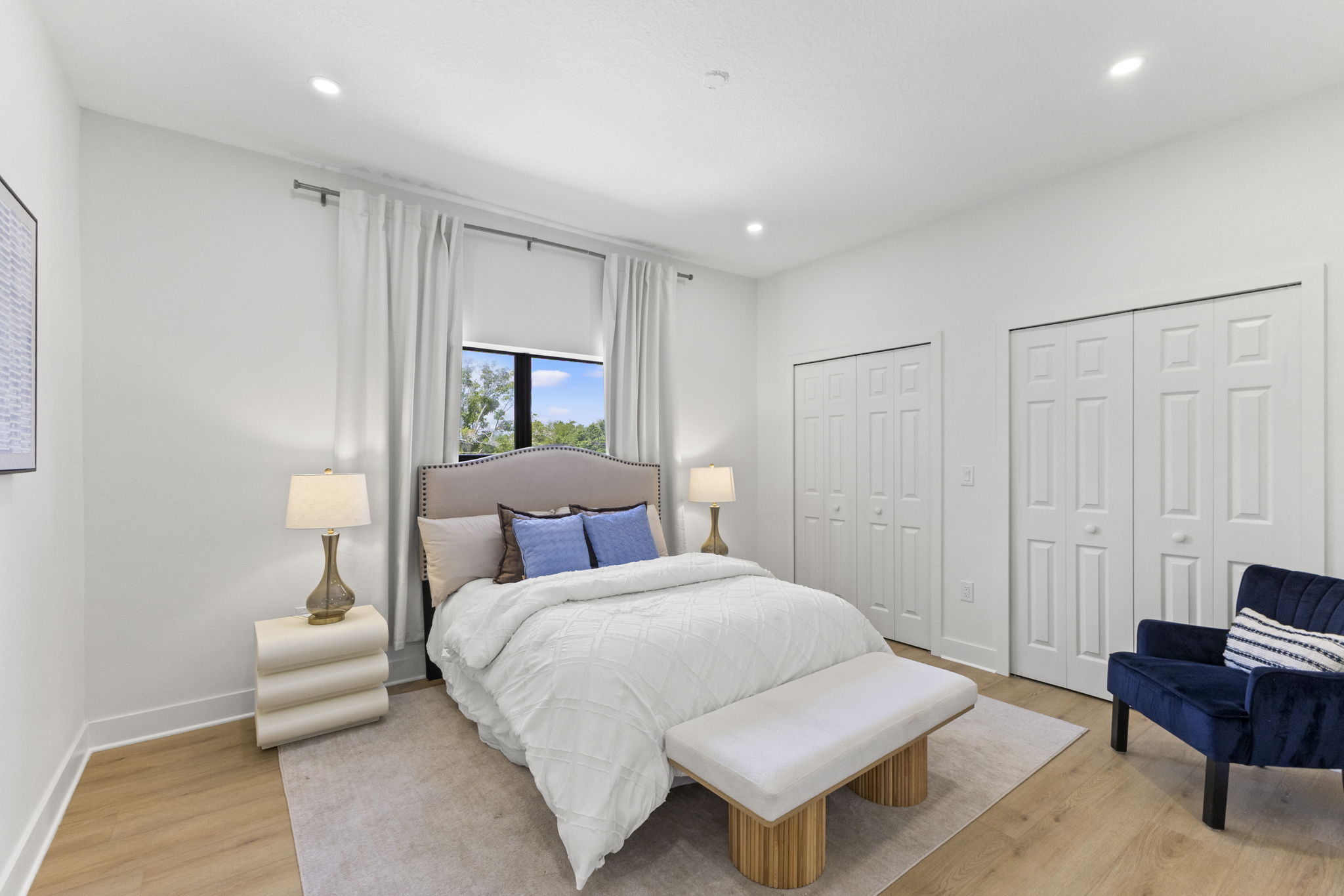 Front bedroom with double closets and a bright window