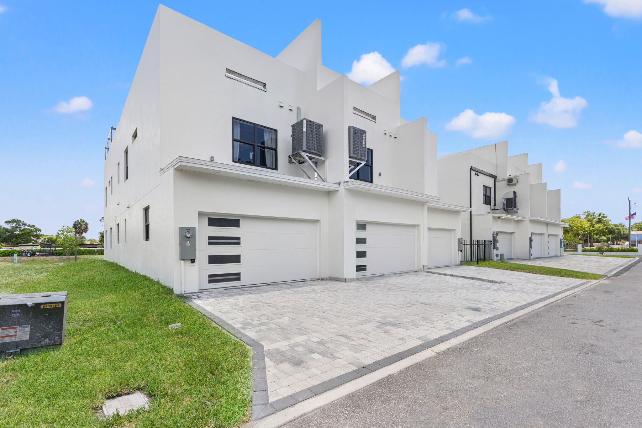 Garage side elevation showing a private two-car garage for each residence at Latitudes in the Park, Pinellas Park FL