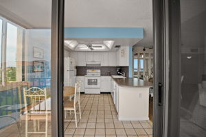 Light, bright kitchen adjacent to balcony