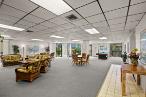 2nd level gthering room with billiards, card tables, lending library and large screen TV