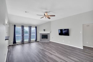 Cozy up in front of the gas fireplace and all with a view of patio and fenced backyard