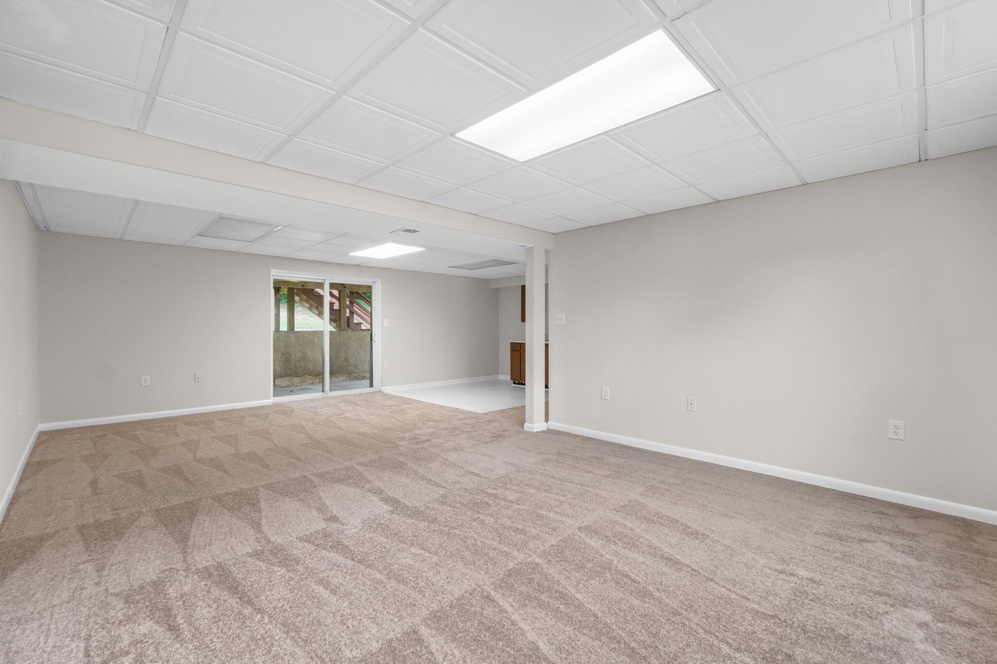 Lower Level Recreation Room with Access to Rear