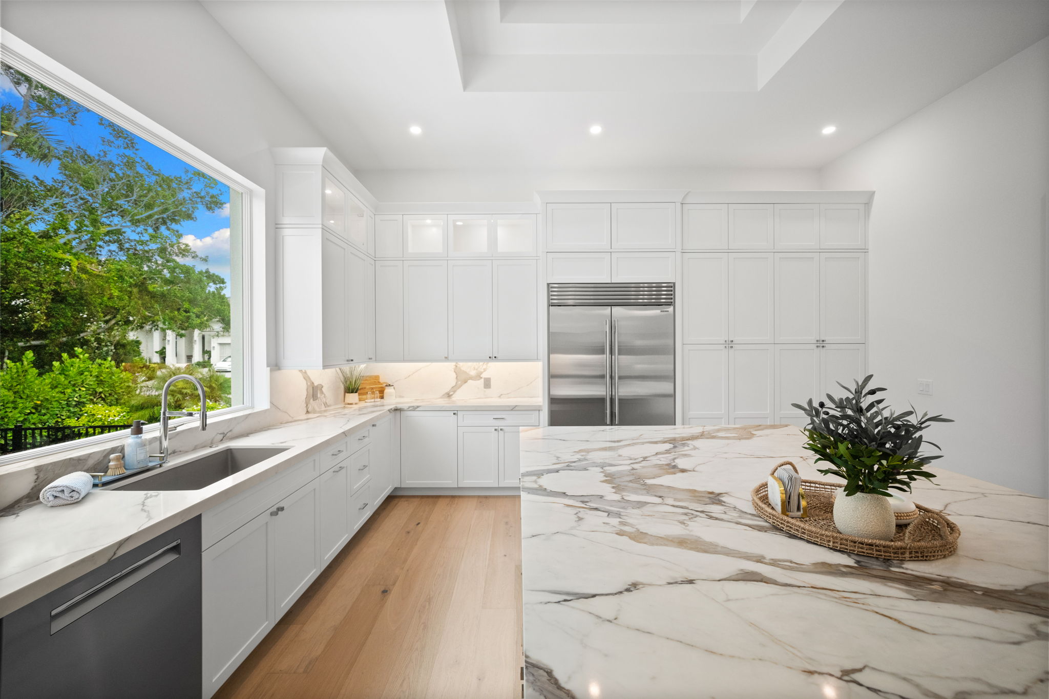 Oversized book-matched Quartz center island