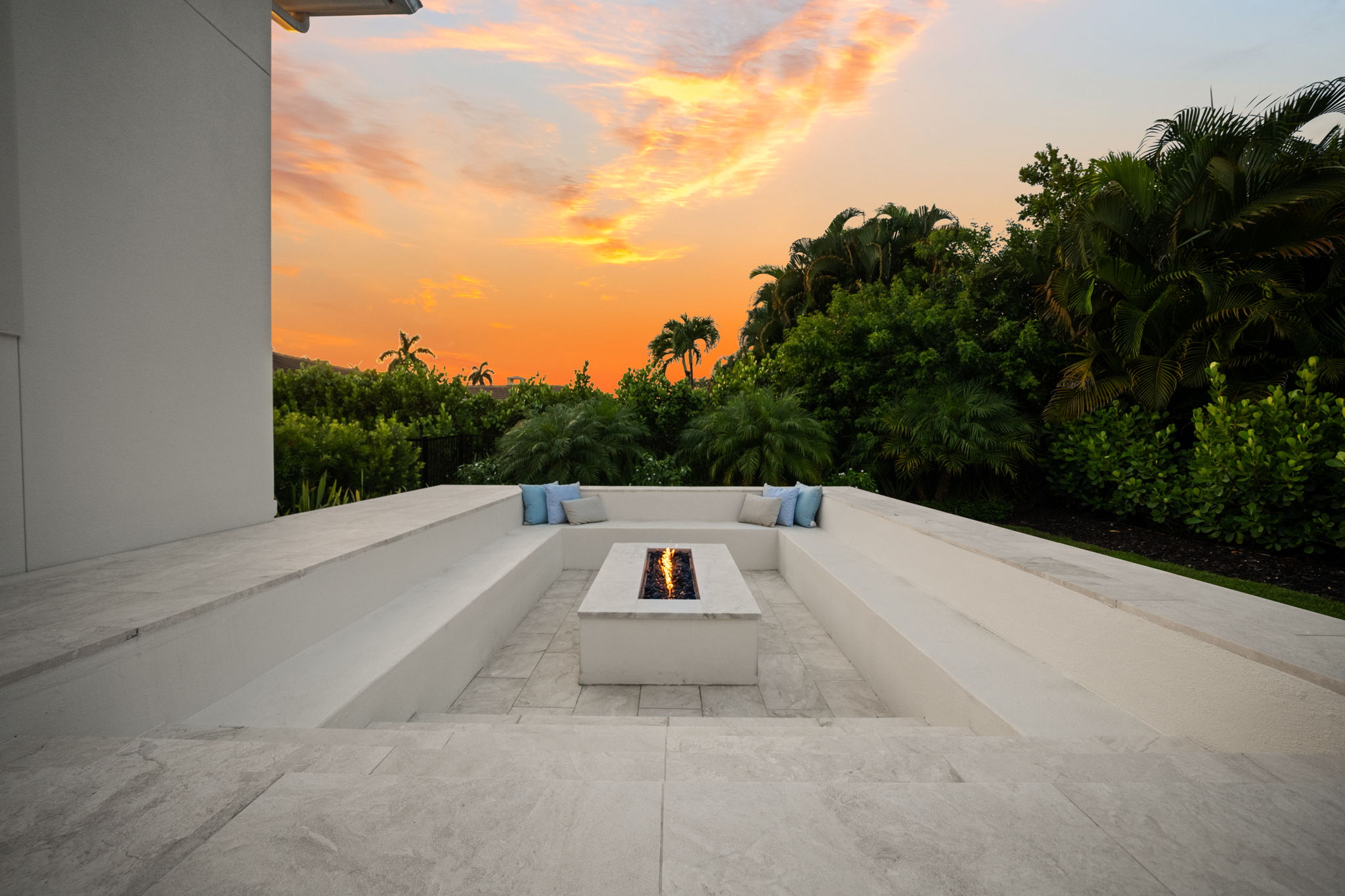 Enjoy endless sunsets in private backyard enclosed by lush landscaping