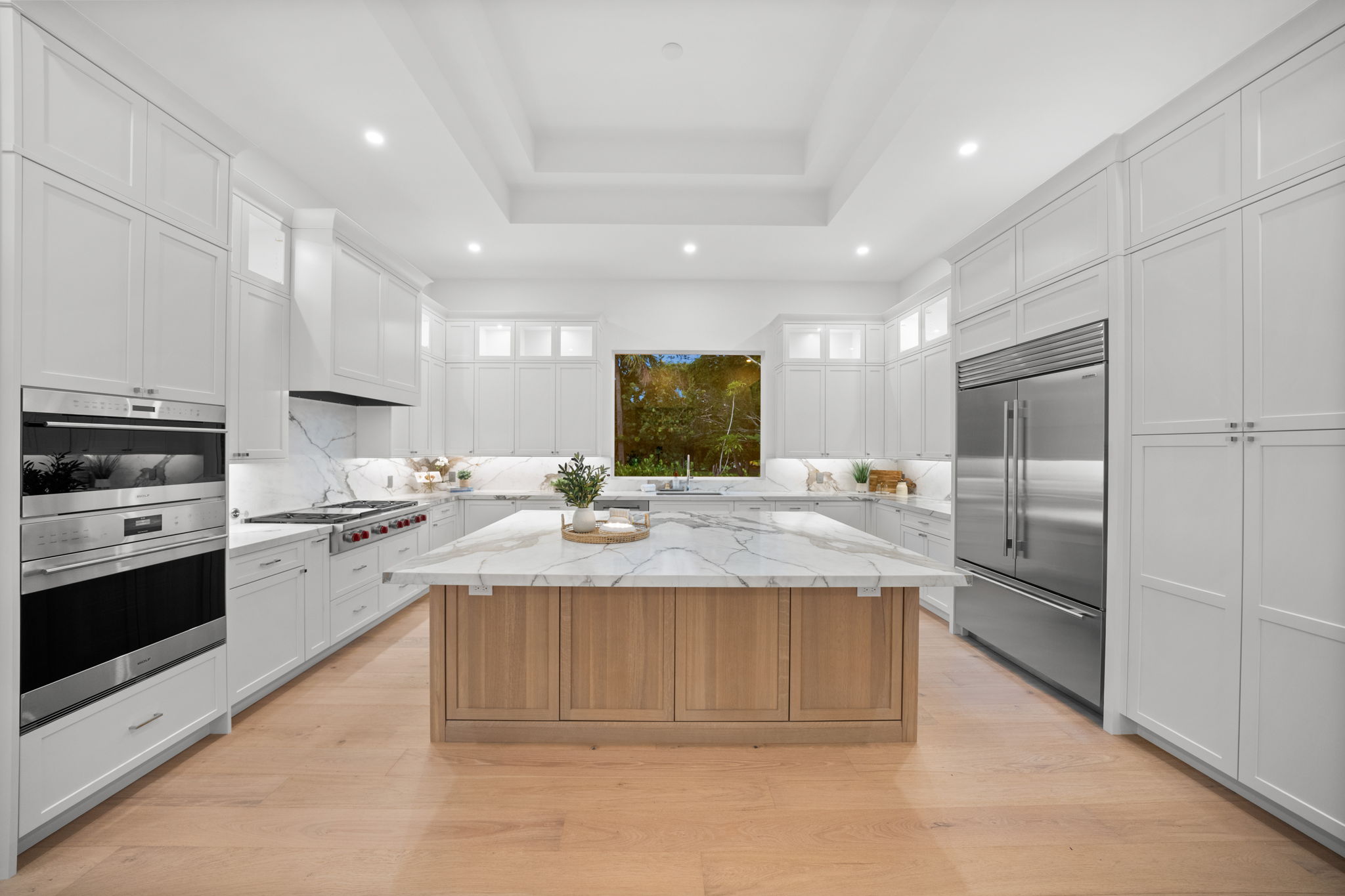Kitchen with extended upper decorative cabinets