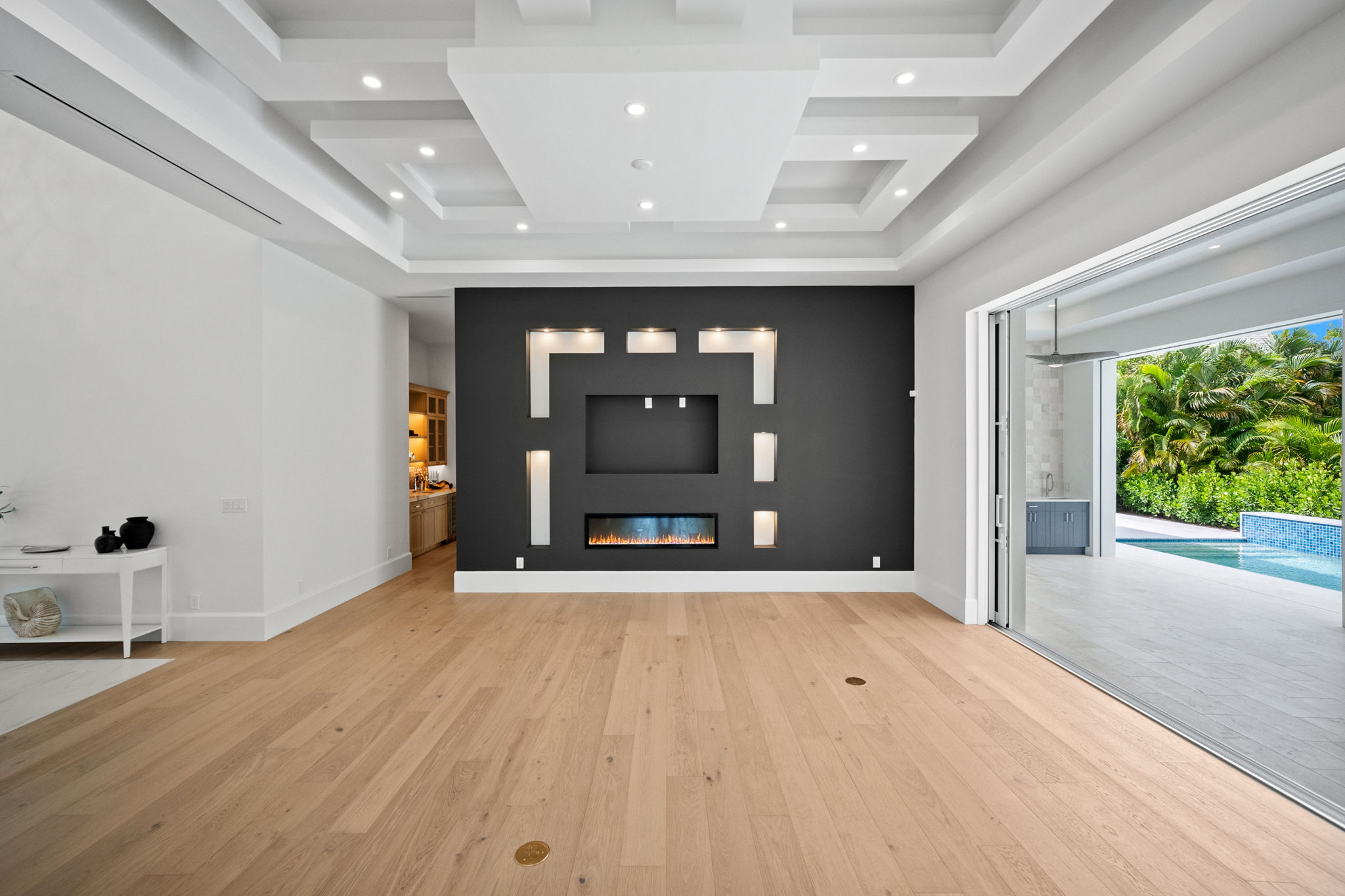 Architectural dropped ceiling details add dimension, depth, and a custom finish to the main living area