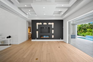 Architectural dropped ceiling details add dimension, depth, and a custom finish to the main living area