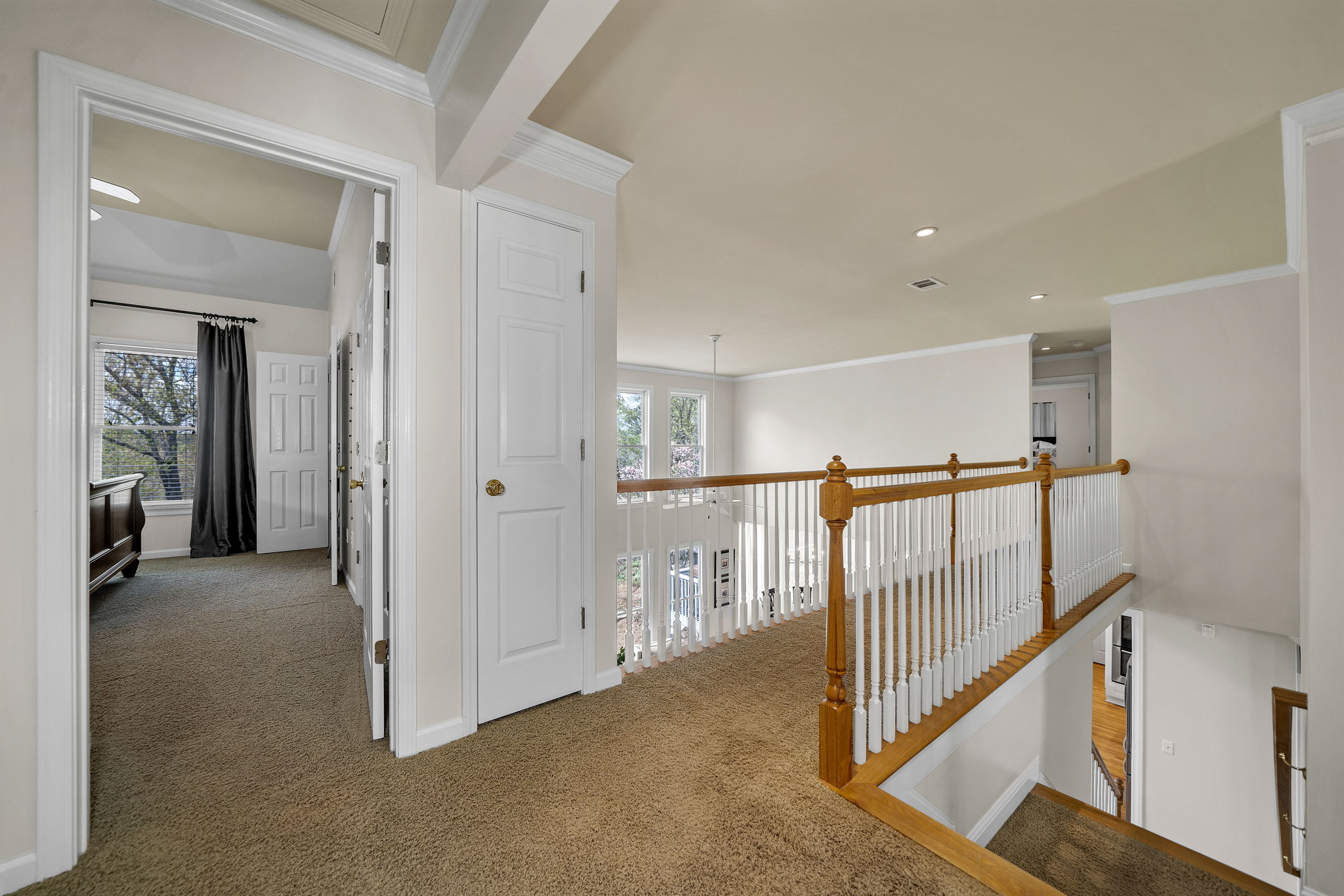 The double stairway opens up to the foyer and greatroom.