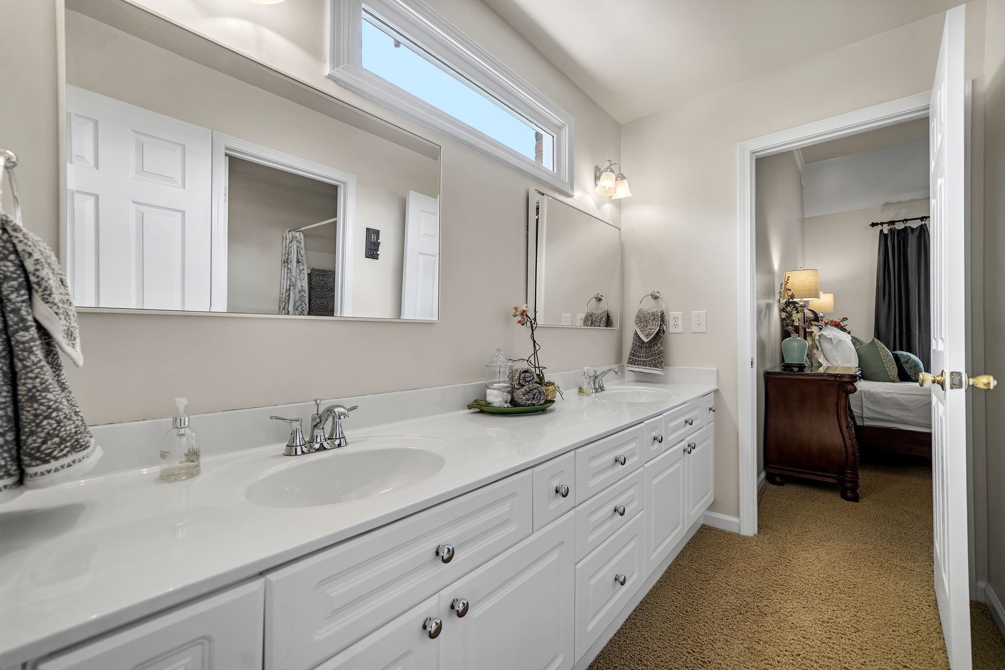 Jack/Jill with has extra-long double vanity and seperate commode/shower area. Perfect for sharing!