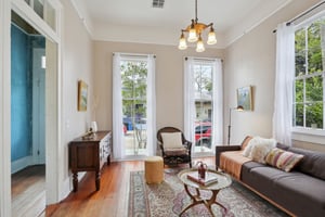 Original hardwood floors, art deco chandelier, picture rail and leaded glass windows lend to the historic charm in this beautiful entertaining space.