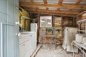The laundry/utility shed is situated off the rear of the house and offers additional storage if needed
