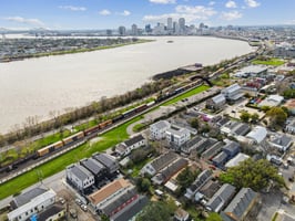 Located just a turn of the River down from the French Quarter and Marigny, the property is situated within Flood Zone X, adjacent to the Mississippi River levee.
