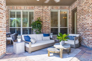 Open concept living and dining area patio with fireplace and TV connection