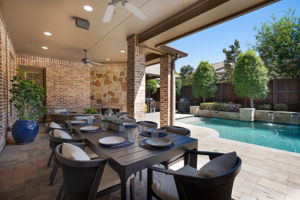 Open concept living and dining area patio with fireplace and TV connection