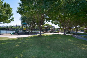 Gated neighborhood park, playground and gazebo with lake views