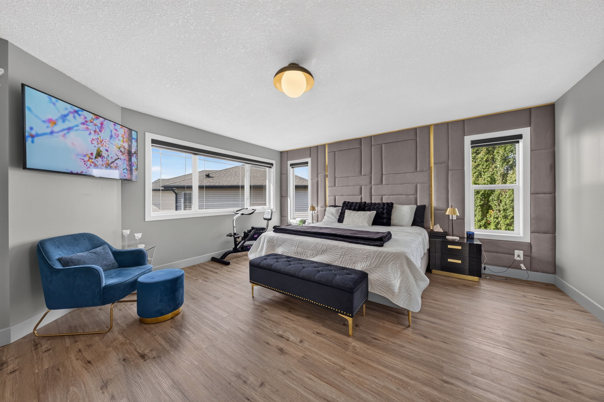 Primary suite with a feature headboard wall