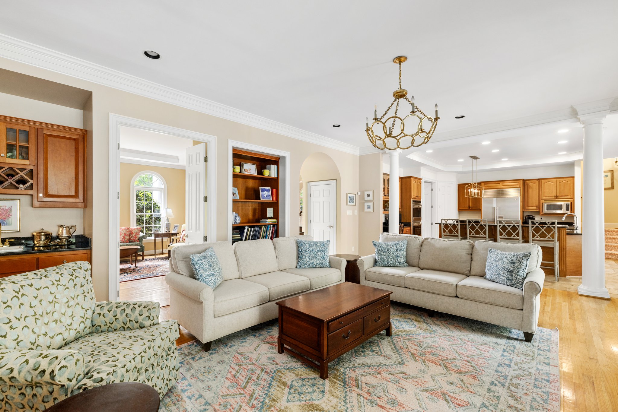 Family room has granite counter wet bar and is open to the kitchen and breakfast room.