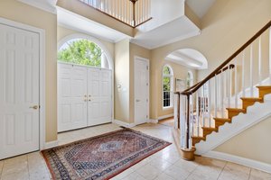 2 coat closets and French door style front door with transom window.