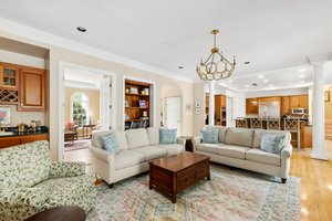 Family room has granite counter wet bar and is open to the kitchen and breakfast room.