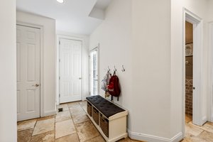 Mud room between kitchen and garage with exterior access to the patio.