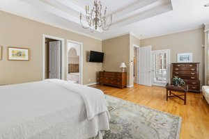 This primary bedroom makes a king bed look small!