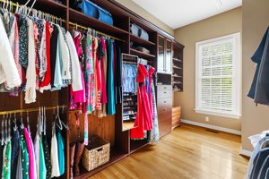 Huge primary closet with custom built-ins.