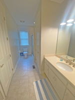 Large bath with linen closet and large adjacent walk in closet.