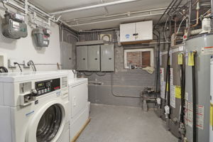 Coin Laundry/Utility Room-4electrical CB boxes, 4 HW tanks, 3 gas meters