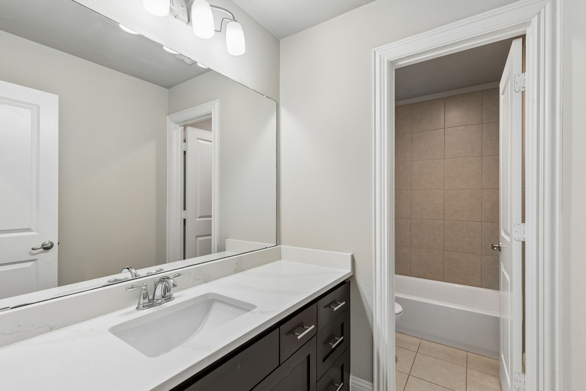 Upstairs secondary bath is updated with a new 2026 quartz countertop
