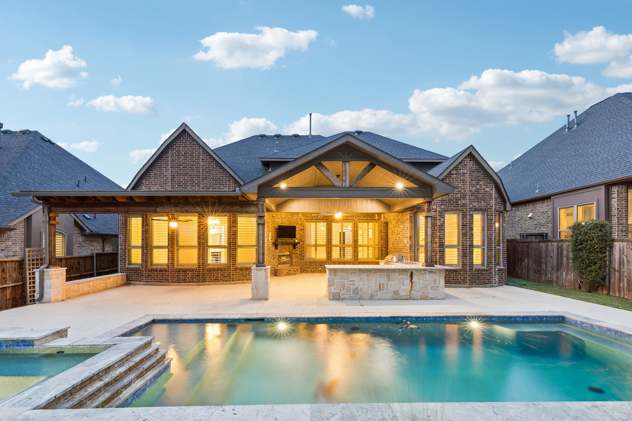 Thoughtfully designed layout with heated pool & spa, expansive covered living space, cedar pergola, granite entertaining bar and low-maintenance turf.