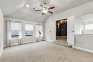 The spacious upstairs game room provides a versatile second living area with direct access to french door media room.